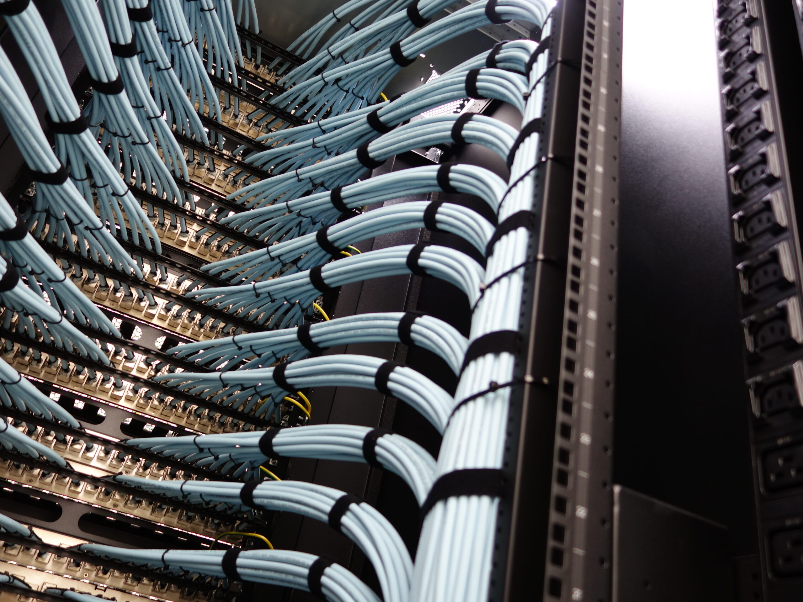 Tidy Network Cables in Data Center Rack with Blue and Black Design